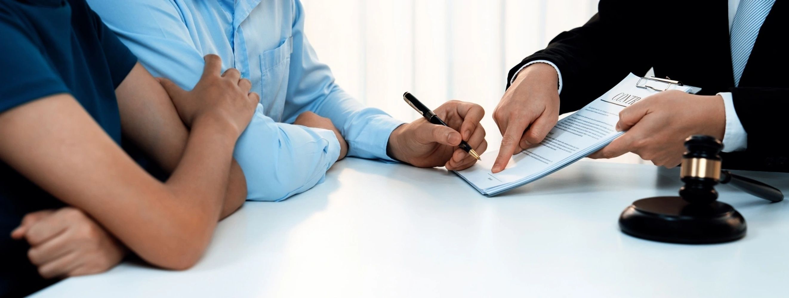 Jennifer Garland with colleagues reviewing legal documents